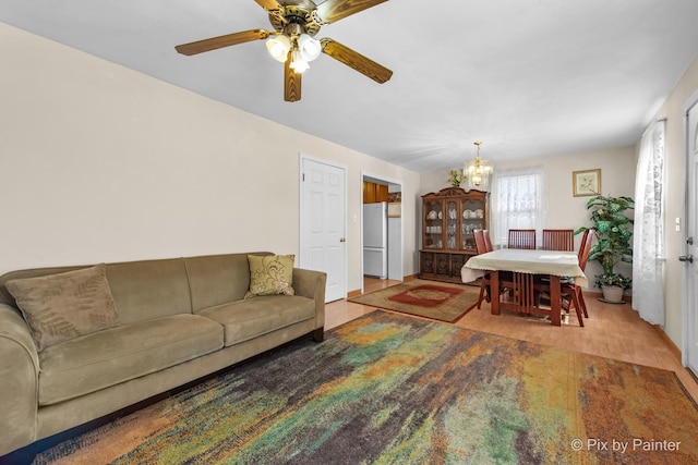 3324 N Ottawa Ave, Chicago, IL 60634 - living room featuring a chandelier, ceiling fan, and wood finished floors