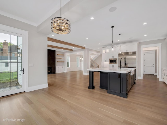 435 S W Ave, Elmhurst, IL 60126 - kitchen featuring built in appliances, baseboards, light countertops, white cabinets, and recessed lighting