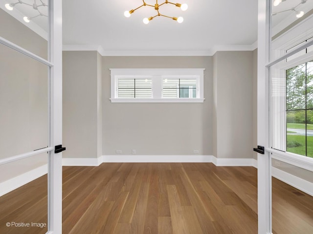 435 S W Ave, Elmhurst, IL 60126 - unfurnished room featuring a chandelier, wood finished floors, crown molding, and baseboards