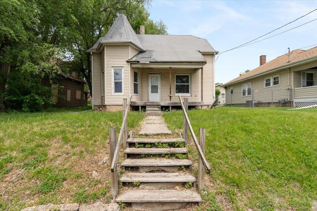 2007 3x Ave, East Moline, IL 61244 - view of front of house with a front lawn, covered porch, and a chimney