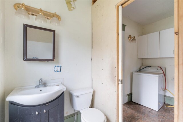 2007 3x Ave, East Moline, IL 61244 - bathroom featuring washer / dryer, toilet, and vanity