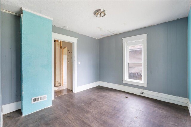 2007 3x Ave, East Moline, IL 61244 - spare room featuring wood finished floors and baseboards