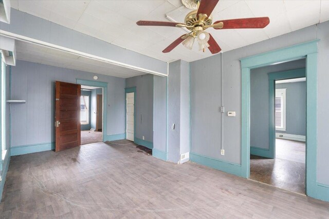2007 3x Ave, East Moline, IL 61244 - unfurnished room featuring wood finished floors, a ceiling fan, and baseboards