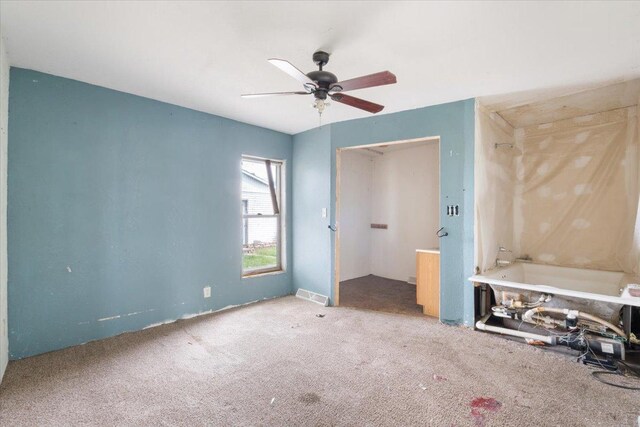 2007 3x Ave, East Moline, IL 61244 - unfurnished bedroom with carpet and a ceiling fan