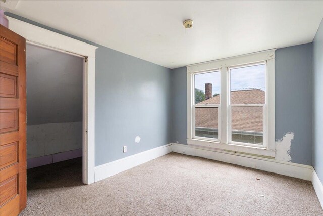 2007 3x Ave, East Moline, IL 61244 - empty room with carpet and baseboards
