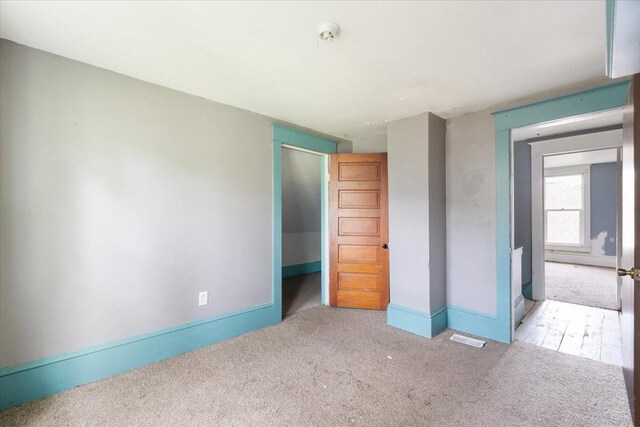 2007 3x Ave, East Moline, IL 61244 - unfurnished bedroom with carpet flooring and baseboards