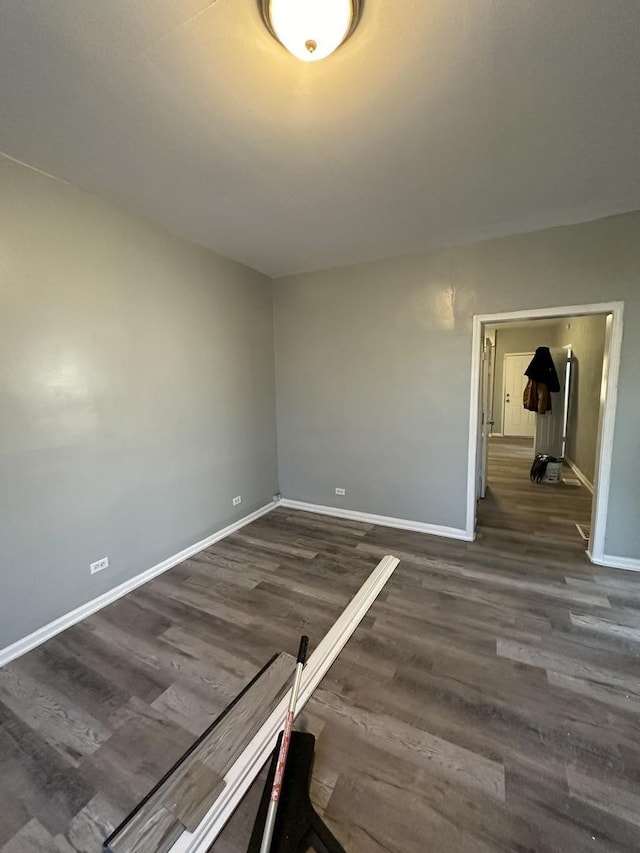 4942 S Racine Ave, Chicago, IL 60609 - empty room featuring baseboards and wood finished floors