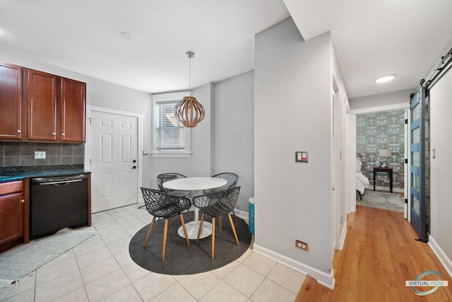 6748 N Greenview Ave Unit 2, Chicago, IL 60626 - dining area with a barn door and baseboards