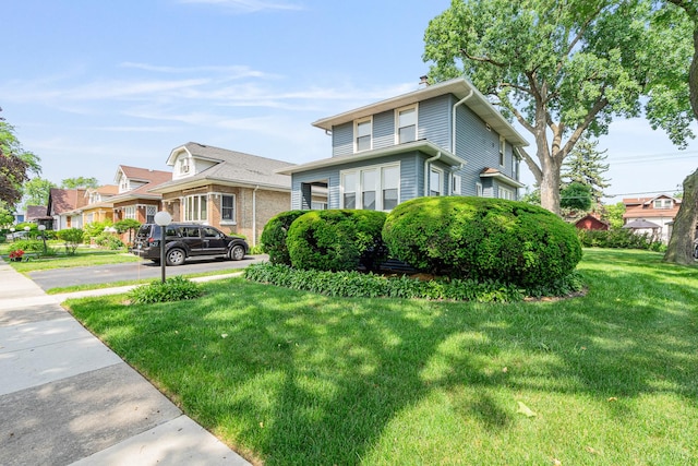 1627 S 14th Ave, Maywood, IL 60153 - view of front of house featuring a front yard and a chimney