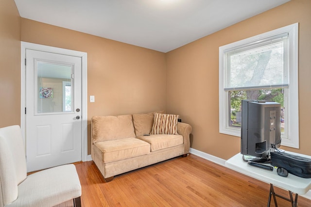 1627 S 14th Ave, Maywood, IL 60153 - living area featuring light wood-style flooring and baseboards