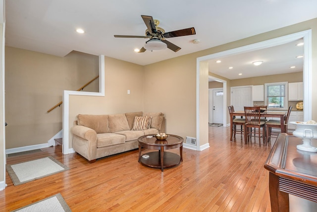1627 S 14th Ave, Maywood, IL 60153 - living room with light wood-type flooring, stairway, ceiling fan, and recessed lighting