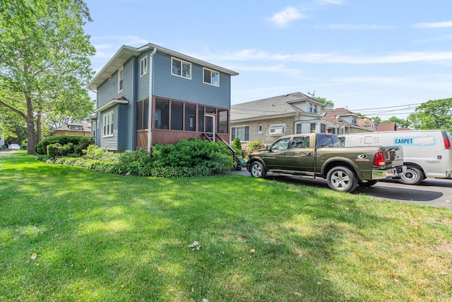 1627 S 14th Ave, Maywood, IL 60153 - view of side of property featuring a yard and a sunroom