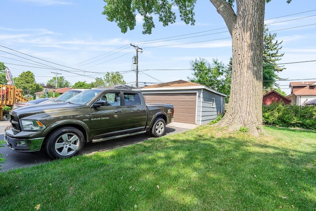 1627 S 14th Ave, Maywood, IL 60153 - view of grassy yard with a garage and an outbuilding
