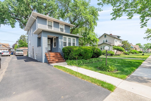 1627 S 14th Ave, Maywood, IL 60153 - american foursquare style home featuring a front lawn and a residential view