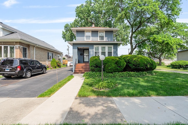 1627 S 14th Ave, Maywood, IL 60153 - american foursquare style home with a front lawn and a chimney
