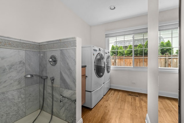 1101 Oak St, Winnetka, IL 60093 - laundry room featuring washing machine and dryer, light wood-type flooring, and baseboards