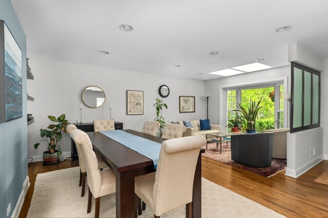 1101 Oak St, Winnetka, IL 60093 - dining room featuring wood finished floors, baseboards, recessed lighting, and a skylight