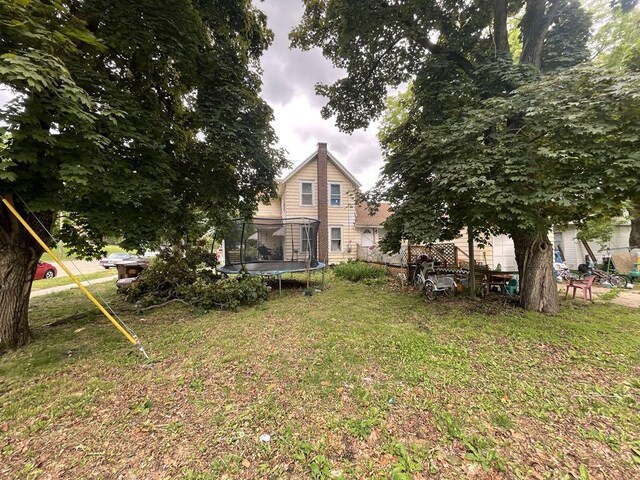 802 Locust St, Prophetstown, IL 61277 - view of yard featuring a trampoline