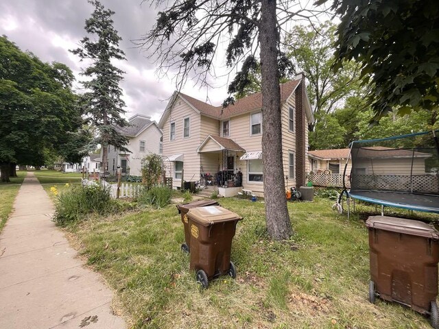 802 Locust St, Prophetstown, IL 61277 - view of front of property with a trampoline and a front yard