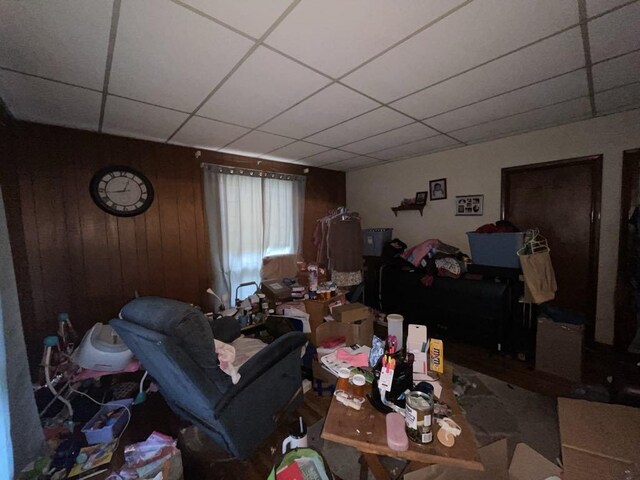 802 Locust St, Prophetstown, IL 61277 - living area with a drop ceiling and wooden walls