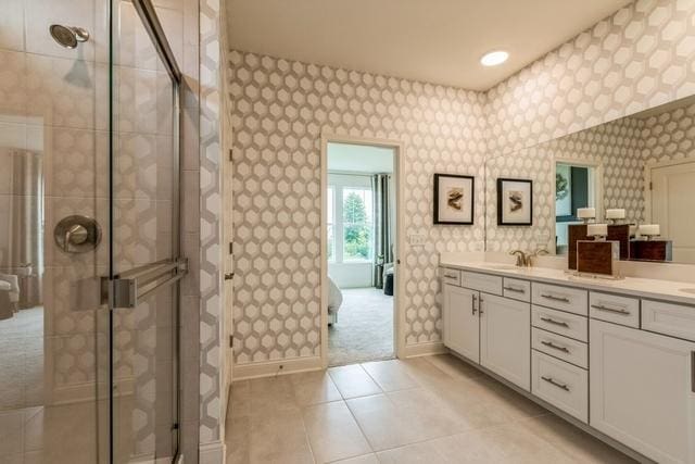 213 Rhinebeck Way, Algonquin, IL 60102 - full bathroom with wallpapered walls, double vanity, a shower stall, baseboards, and tile patterned floors
