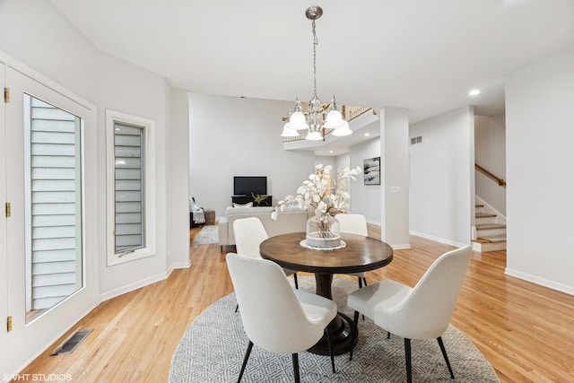 1040 E Buckingham Dr, Naperville, IL 60563 - dining room with a chandelier, light wood-type flooring, stairs, baseboards, and recessed lighting
