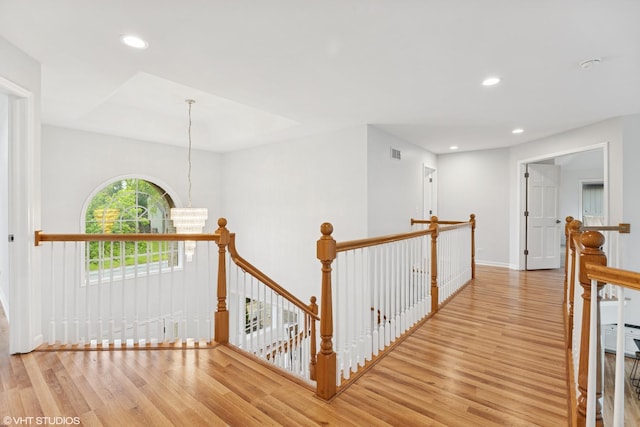 1040 E Buckingham Dr, Naperville, IL 60563 - corridor with an upstairs landing, wood finished floors, recessed lighting, a chandelier, and baseboards