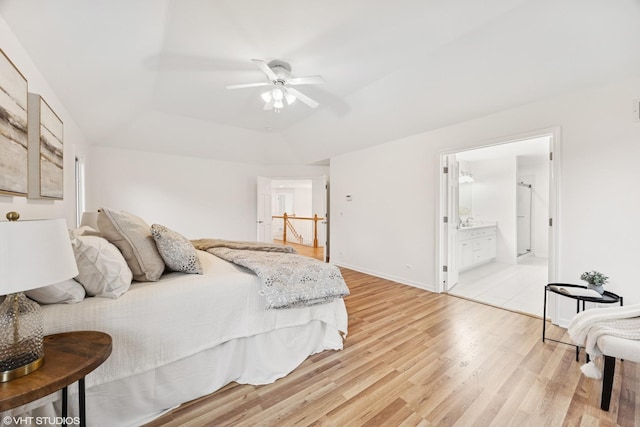 1040 E Buckingham Dr, Naperville, IL 60563 - bedroom with light wood-type flooring, a raised ceiling, ensuite bath, baseboards, and a ceiling fan