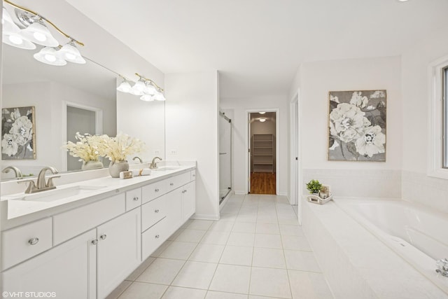 1040 E Buckingham Dr, Naperville, IL 60563 - bathroom with tile patterned floors, double vanity, a shower stall, and a bath