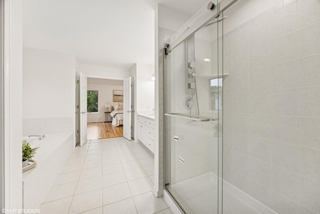 1040 E Buckingham Dr, Naperville, IL 60563 - bathroom with a garden tub, tile patterned flooring, a stall shower, and vanity