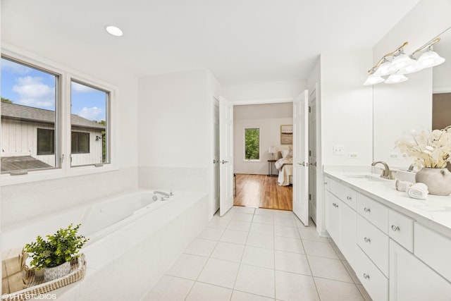 1040 E Buckingham Dr, Naperville, IL 60563 - ensuite bathroom with vanity, a garden tub, tile patterned flooring, and recessed lighting