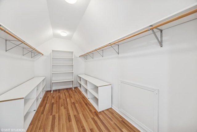 1040 E Buckingham Dr, Naperville, IL 60563 - spacious closet featuring lofted ceiling and light wood finished floors
