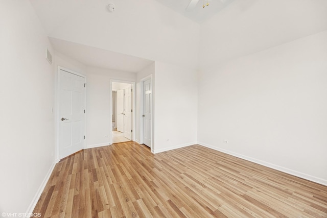1040 E Buckingham Dr, Naperville, IL 60563 - empty room with light wood-style floors, baseboards, ceiling fan, and a smoke detector