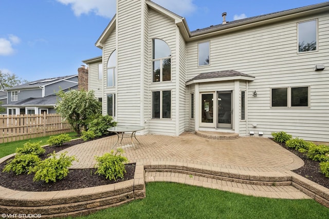 1040 E Buckingham Dr, Naperville, IL 60563 - rear view of property with a patio and a chimney