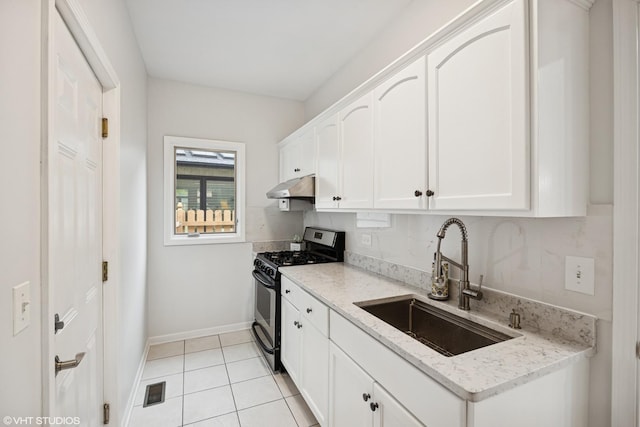 1040 E Buckingham Dr, Naperville, IL 60563 - kitchen featuring stainless steel gas range, a sink, under cabinet range hood, white cabinets, and baseboards