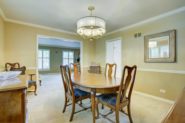 1056 Whirlaway Ave, Naperville, IL 60540 - dining room with light colored carpet, ornamental molding, baseboards, and a chandelier