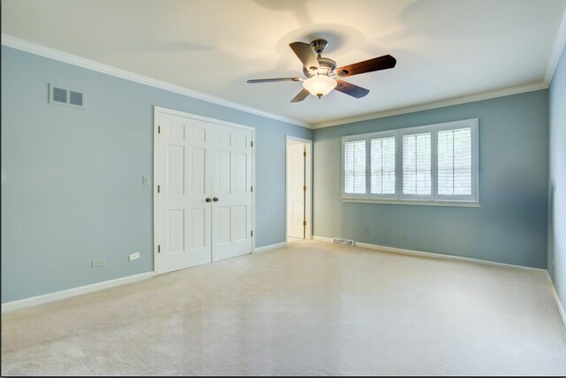 1056 Whirlaway Ave, Naperville, IL 60540 - unfurnished bedroom featuring crown molding, a closet, carpet flooring, and baseboards