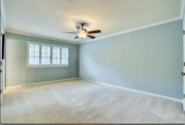 1056 Whirlaway Ave, Naperville, IL 60540 - unfurnished room featuring ceiling fan, crown molding, baseboards, and carpet flooring