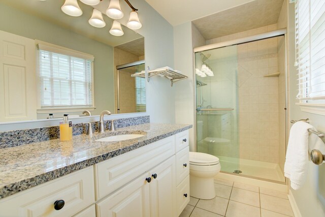 1056 Whirlaway Ave, Naperville, IL 60540 - bathroom featuring tile patterned floors, toilet, vanity, and a shower stall