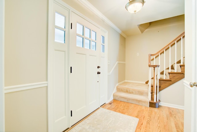 1056 Whirlaway Ave, Naperville, IL 60540 - foyer with stairway, light wood-type flooring, crown molding, and baseboards