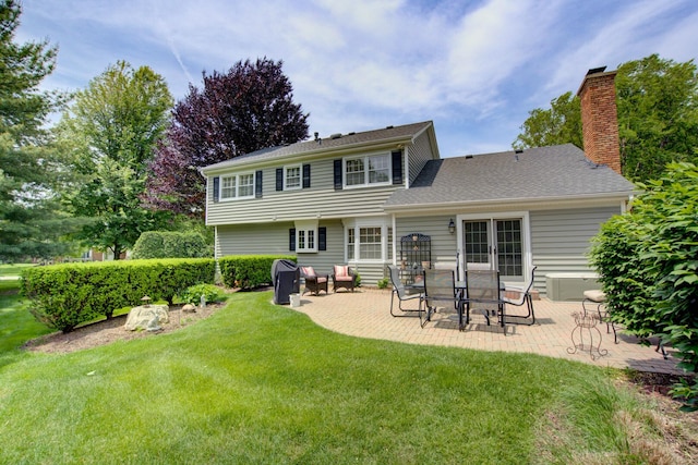 1056 Whirlaway Ave, Naperville, IL 60540 - rear view of property featuring a patio area, a yard, and a chimney