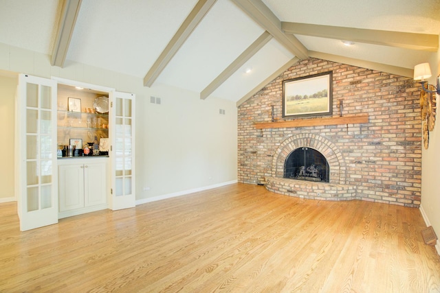 1056 Whirlaway Ave, Naperville, IL 60540 - unfurnished living room featuring light wood-style floors, a brick fireplace, and baseboards