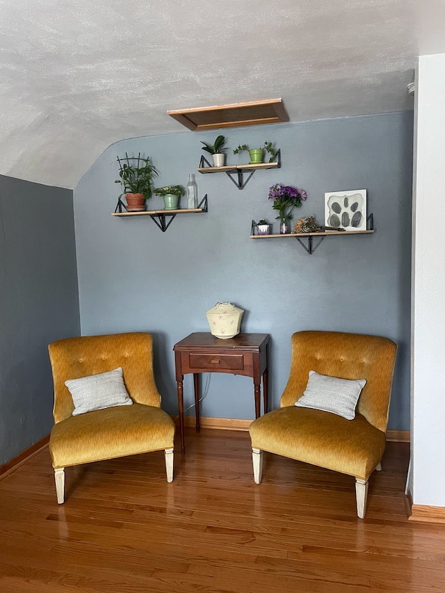130 First St, Cary, IL 60013 - sitting room with wood finished floors, lofted ceiling, a textured ceiling, and baseboards