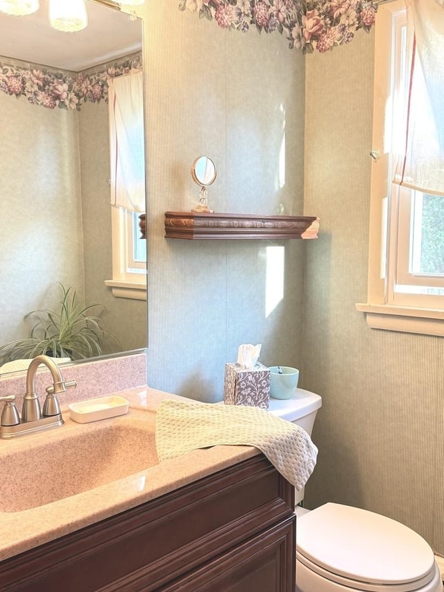 130 First St, Cary, IL 60013 - half bath with toilet, wallpapered walls, and vanity