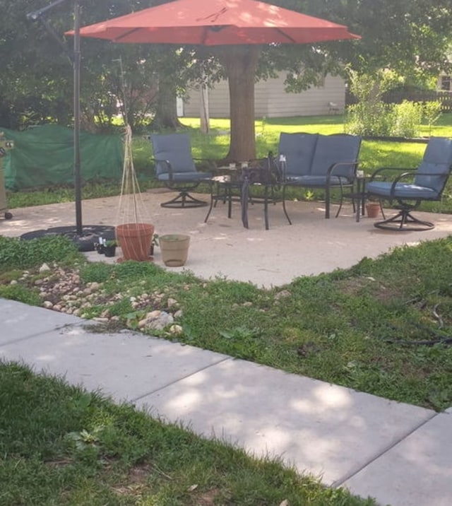130 First St, Cary, IL 60013 - surrounding community with a patio area and a lawn