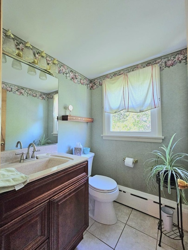 130 First St, Cary, IL 60013 - bathroom featuring toilet, vanity, tile patterned floors, and baseboard heating