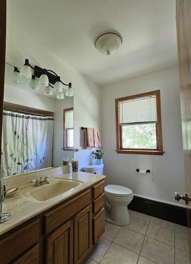 130 First St, Cary, IL 60013 - bathroom featuring toilet, tile patterned floors, vanity, and a shower with shower curtain