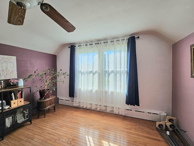 130 First St, Cary, IL 60013 - bedroom with lofted ceiling, hardwood / wood-style floors, a ceiling fan, and a baseboard radiator