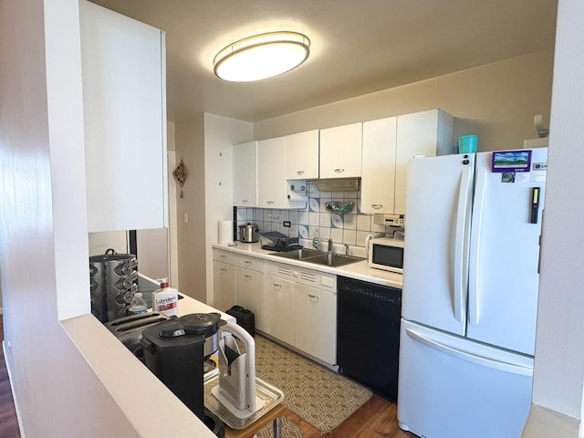 6301 N Sheridan Rd Unit 14E, Chicago, IL 60660 - kitchen with white appliances, a sink, light countertops, white cabinets, and decorative backsplash