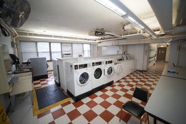 6301 N Sheridan Rd Unit 14E, Chicago, IL 60660 - communal laundry room featuring light flooring and washing machine and dryer